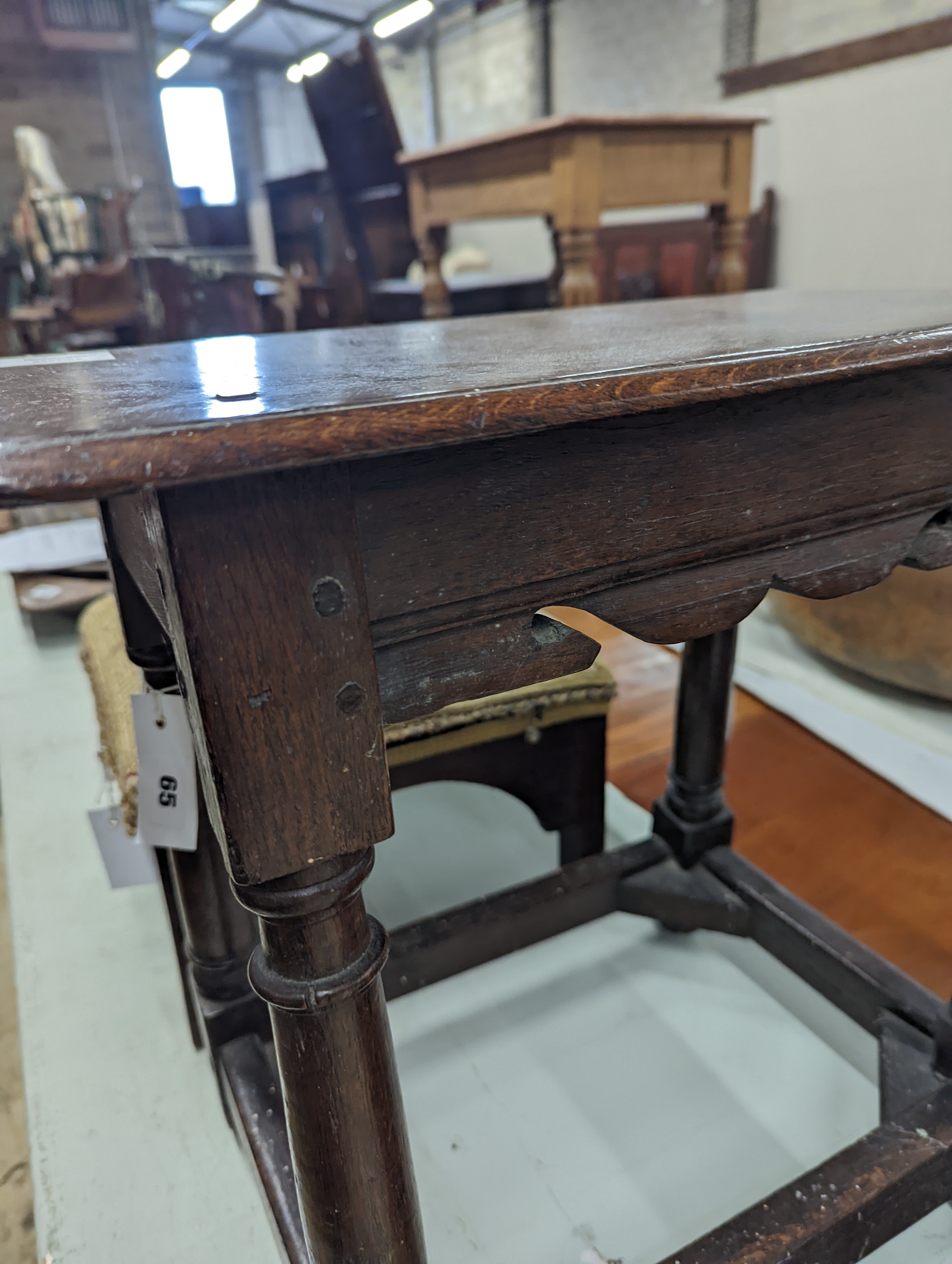 A 17th century style oak joint stool, width 46cm, depth 26cm, height 46cm and a George III stool with Victorian needlework seat, length 33cm